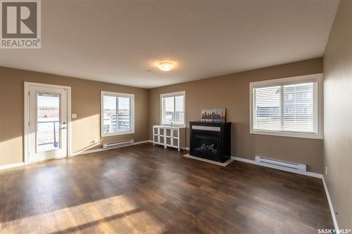 18 Shady Pine Drive, Craik Rm No. 222, SK - Indoor Photo Showing Living Room With Fireplace