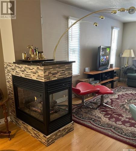 3241 15Th Avenue, Regina, SK - Indoor Photo Showing Living Room With Fireplace