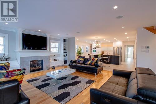 90 De La Breche Unit# 114, Grand-Barachois, NB - Indoor Photo Showing Living Room With Fireplace