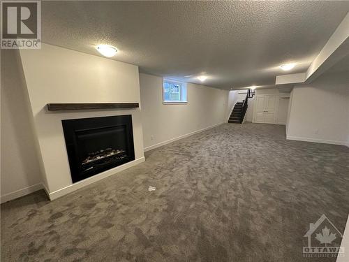 rec room - 563 Knotridge Street, Ottawa, ON - Indoor With Fireplace