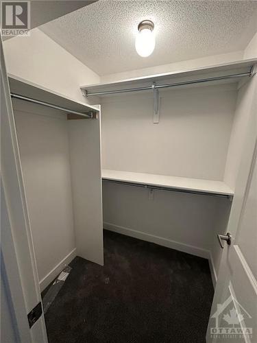 Lower level bedroom WIC - 563 Knotridge Street, Ottawa, ON - Indoor With Storage
