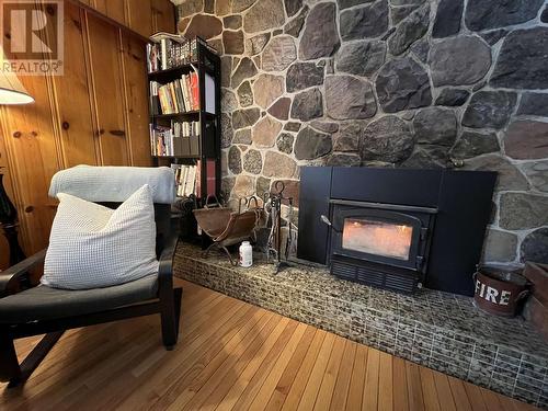 6809 Old Alaska Highway, Fort Nelson, BC - Indoor Photo Showing Living Room With Fireplace