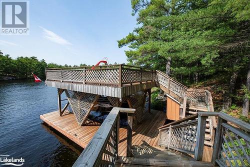 View of the Boat Port from the main cottage deck - 4406 Conners Bay Lane, Severn, ON - Outdoor With Body Of Water
