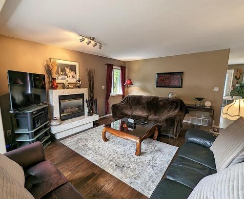 902 Houston Street W, Nelson, BC - Indoor Photo Showing Living Room With Fireplace