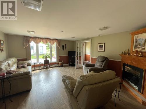 61 Forest Road, Milltown, Head Of Bay D'Espoir, NL - Indoor Photo Showing Living Room With Fireplace