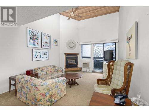 1056 Bernard Avenue Unit# 310, Kelowna, BC - Indoor Photo Showing Living Room With Fireplace
