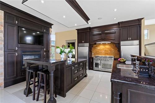 Island with 2 sided fireplace - 6771 Calaguiro Drive, Niagara Falls, ON - Indoor Photo Showing Kitchen With Upgraded Kitchen