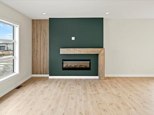 81 Wild Plum Lane, Steinbach, MB - Indoor Photo Showing Living Room With Fireplace