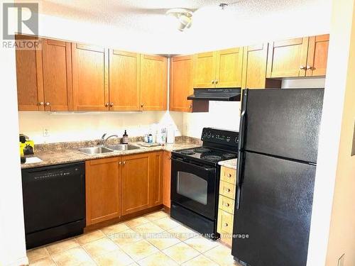 310 - 5235 Finch Avenue E, Toronto, ON - Indoor Photo Showing Kitchen With Double Sink