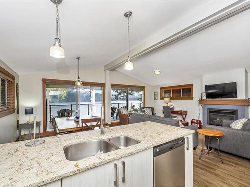 250-6596 Baird Rd, Port Renfrew, BC - Indoor Photo Showing Kitchen With Fireplace With Double Sink