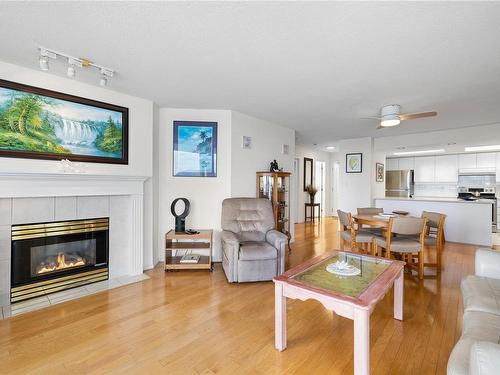 406-158 Promenade Dr, Nanaimo, BC - Indoor Photo Showing Living Room With Fireplace