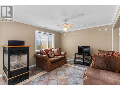 3380 Neid Road, Kelowna, BC - Indoor Photo Showing Living Room With Fireplace