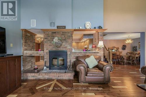 1047 Country Lane, Central Frontenac, ON - Indoor Photo Showing Living Room With Fireplace