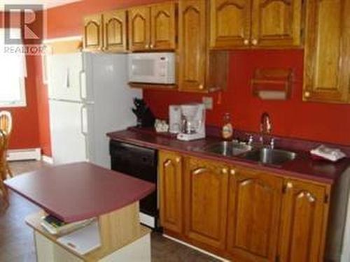 1081-1083 Main Highway, Placentia, NL - Indoor Photo Showing Kitchen With Double Sink