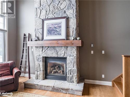 3876 Muskoka Road 118 Unit# Sandfield 5 W10, Port Carling, ON - Indoor Photo Showing Living Room With Fireplace