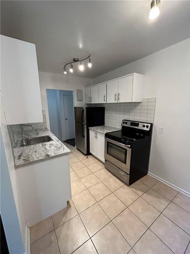 21 Balmoral Avenue S|Unit #105, Hamilton, ON - Indoor Photo Showing Kitchen