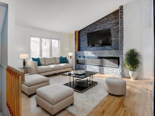 Living room - 4383 Rue De Beaubassin, Terrebonne (Terrebonne), QC - Indoor Photo Showing Living Room With Fireplace