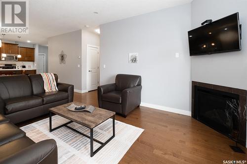 506 2055 Rose Street, Regina, SK - Indoor Photo Showing Living Room With Fireplace