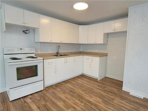 633 Home Street, Portage La Prairie, MB - Indoor Photo Showing Kitchen With Double Sink