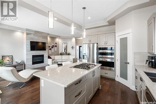 758 Kloppenburg Court, Saskatoon, SK - Indoor Photo Showing Kitchen With Fireplace With Upgraded Kitchen