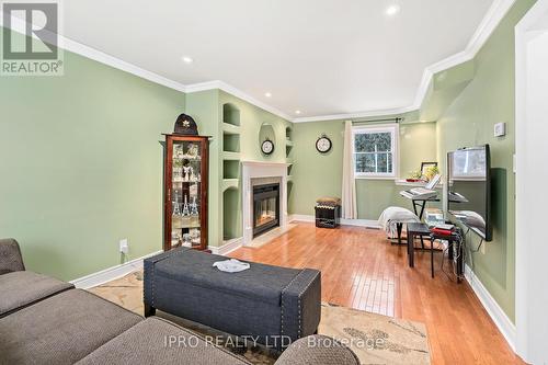 32 Agnes St, Caledon, ON - Indoor Photo Showing Living Room With Fireplace