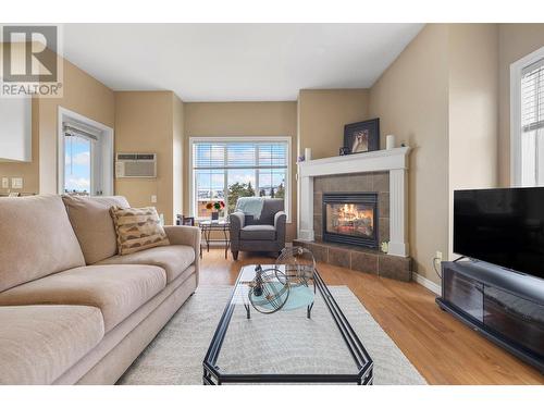 1125 Bernard Avenue Unit# 406, Kelowna, BC - Indoor Photo Showing Living Room With Fireplace