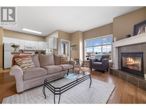 1125 Bernard Avenue Unit# 406, Kelowna, BC - Indoor Photo Showing Living Room With Fireplace
