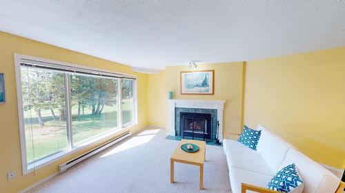 7 - 7555 Columbia Avenue, Radium Hot Springs, BC - Indoor Photo Showing Living Room With Fireplace