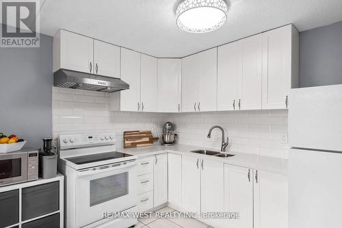 226 - 580 Mary Street E, Whitby, ON - Indoor Photo Showing Kitchen With Double Sink