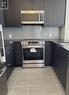 208 - 50 Thomas Riley Road, Toronto, ON  - Indoor Photo Showing Kitchen With Stainless Steel Kitchen With Upgraded Kitchen 
