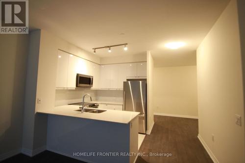 208 - 50 Thomas Riley Road, Toronto, ON - Indoor Photo Showing Kitchen With Double Sink