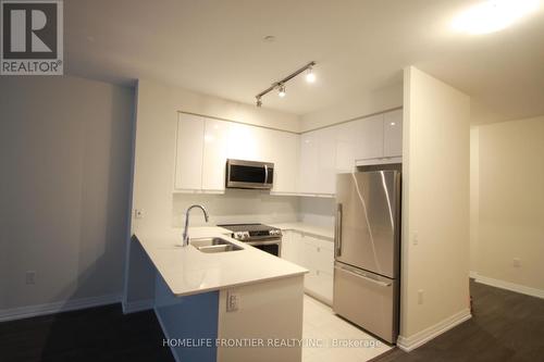 208 - 50 Thomas Riley Road, Toronto (Islington-City Centre West), ON - Indoor Photo Showing Kitchen With Stainless Steel Kitchen With Double Sink