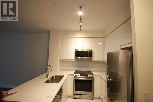 208 - 50 Thomas Riley Road, Toronto, ON - Indoor Photo Showing Kitchen With Stainless Steel Kitchen With Double Sink