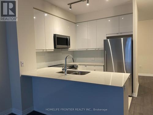 208 - 50 Thomas Riley Road, Toronto (Islington-City Centre West), ON - Indoor Photo Showing Kitchen With Double Sink