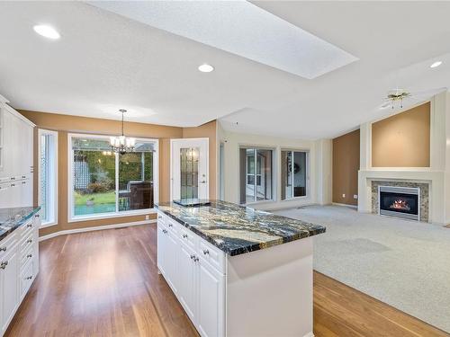 802 Windward Pl, Qualicum Beach, BC - Indoor Photo Showing Kitchen With Fireplace