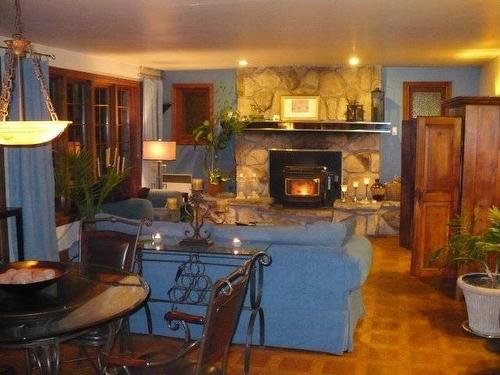 IntÃ©rieur - 2 Rue Dandurand, Bois-Des-Filion, QC - Indoor Photo Showing Living Room With Fireplace