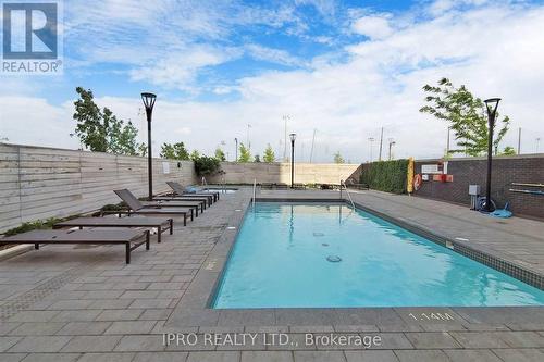 1212 - 1050 Main Street, Milton, ON - Outdoor With In Ground Pool