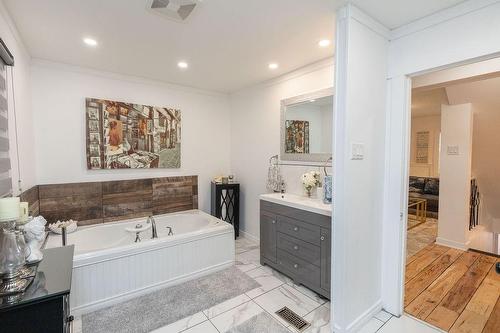 Main floor spa like bathroom with jetted tub - 252 Walter Avenue N, Hamilton, ON - Indoor Photo Showing Bathroom