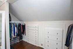 Primary bedroom built in cupboard and closet area - 