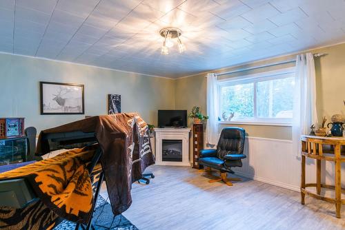1110 Highway 22, Rossland, BC - Indoor Photo Showing Other Room With Fireplace