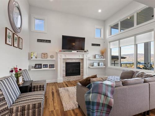 5680 Mountainside Drive, Kelowna, BC - Indoor Photo Showing Living Room With Fireplace