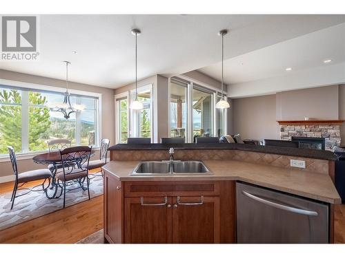 179 Longspoon Drive, Vernon, BC - Indoor Photo Showing Kitchen With Fireplace With Double Sink