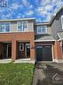 high end new construction townhome is 99% complete and ready for 30-60 day possession.  This is an actual photo of the property, the following interior photos shown are of the model home. - 91 Mandevilla Crescent, Ottawa, ON  - Outdoor 