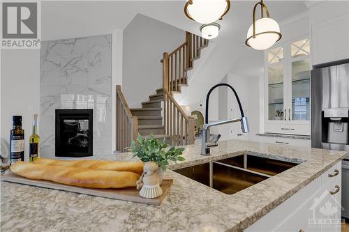 91 Mandevilla Crescent, Ottawa, ON - Indoor Photo Showing Kitchen With Fireplace With Double Sink