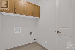 Convenient 2nd floor laundry room with upper cabinets - 