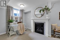 convenient "nook" in lower level, provides a nice workspace.  Fireplace shown in the model home is not included in the actual property. - 