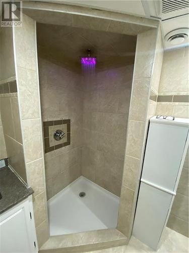 Colour changing lighted showerhead and recessed shelf for your shower supplies. - 6 Monaco Crescent, Cornwall, ON - Indoor Photo Showing Bathroom