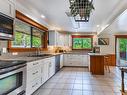 4775 Anderson Ave, Bowser, BC  - Indoor Photo Showing Kitchen With Double Sink 