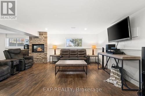 107 Countrycharm Dr, Belleville, ON - Indoor Photo Showing Living Room With Fireplace