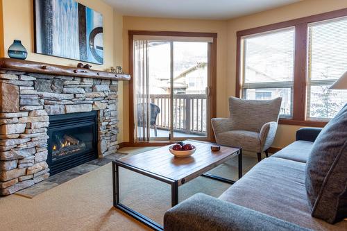 308 - 2080 Summit Drive, Panorama, BC - Indoor Photo Showing Living Room With Fireplace